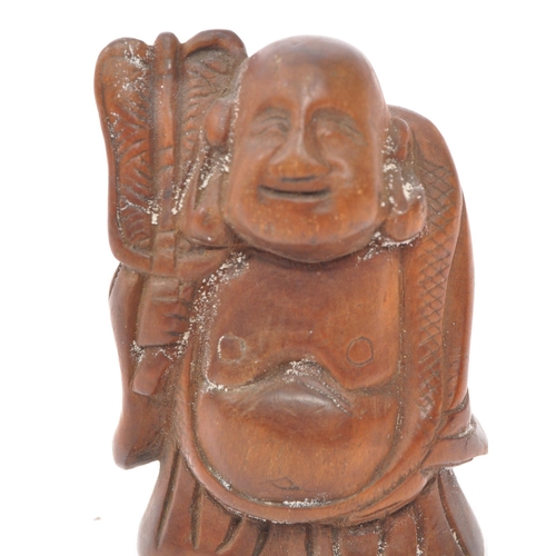 255 - A 20th century Japanese fruitwood buddha netsuke being hand carved and depicted holdingÂ khakkhara. ... 