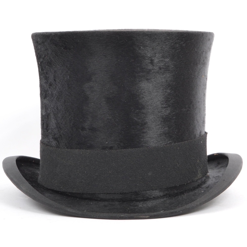 262 - A 19th / early 20th century Christys' of London silk top hat. In a black colourway with curved sides... 