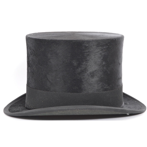 262 - A 19th / early 20th century Christys' of London silk top hat. In a black colourway with curved sides... 