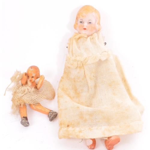 268 - 2 19th century miniature porcelain dolls with lace clothing and bonnets having articulated arms and ... 