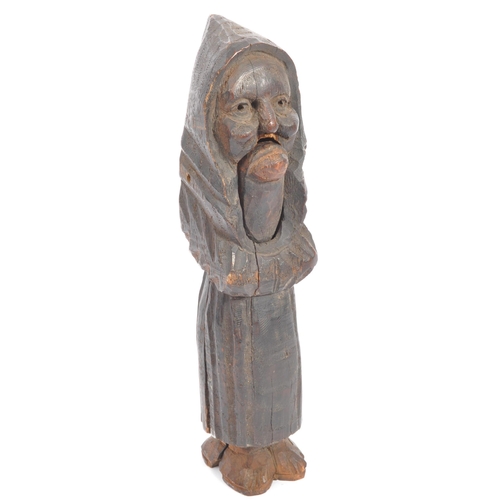 270 - A pair of Gothic Germanic Black Forest wooden nutcrackers in the form of an old lady. The wooden car... 