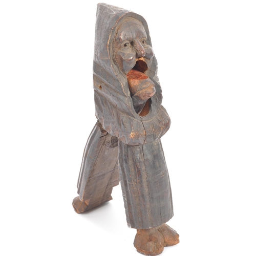 270 - A pair of Gothic Germanic Black Forest wooden nutcrackers in the form of an old lady. The wooden car... 