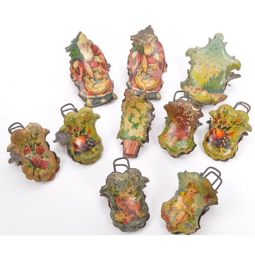 279 - A collection of 19th century Christmas tree tin plate clip candle holders. Each clip having wire wor... 