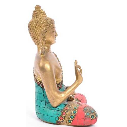 293 - A 20th century brass Indian Buddha ornament depicted inÂ Abhaya Mudra and being set with faux turquo... 