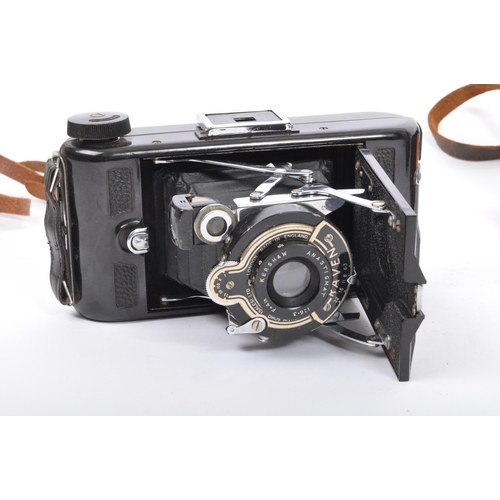 297 - Two pairs of 20th century folding cameras to include a Kodak vest pocket model B camera and a Raven ... 