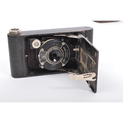 297 - Two pairs of 20th century folding cameras to include a Kodak vest pocket model B camera and a Raven ... 