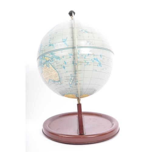 298 - An early 20th century circa. 1930's century desk top world globe upon a painted tin base.