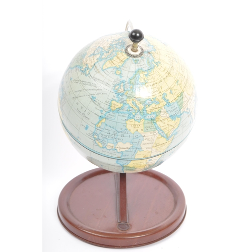 298 - An early 20th century circa. 1930's century desk top world globe upon a painted tin base.