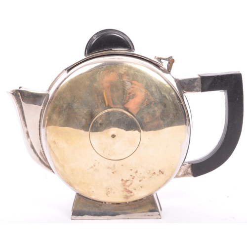 301 - A 20th century circa. 1940's silver plated tea service in the manner of Christopher Dresser. Compris... 