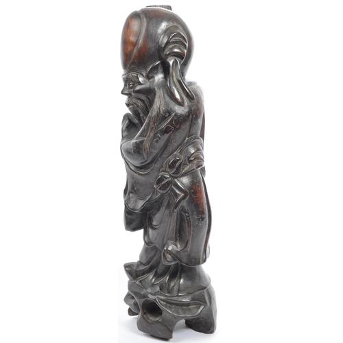 303 - A 19th century Chinese figure, hand carved in the form of immortalÂ Shouxing. The figure having inla... 