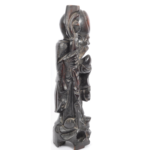 303 - A 19th century Chinese figure, hand carved in the form of immortalÂ Shouxing. The figure having inla... 