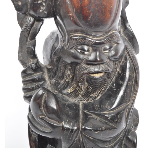 303 - A 19th century Chinese figure, hand carved in the form of immortalÂ Shouxing. The figure having inla... 