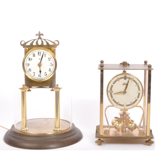 308 - A pair of vintage 20th century anniversary clocks to include a German example in glazed square case ... 