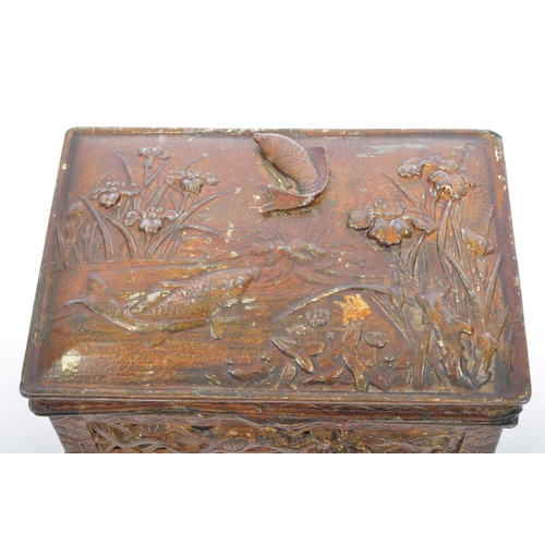 311 - An early 20th century circa. 1920's gilt metal cigarette box. The casket having repousse and relief ... 