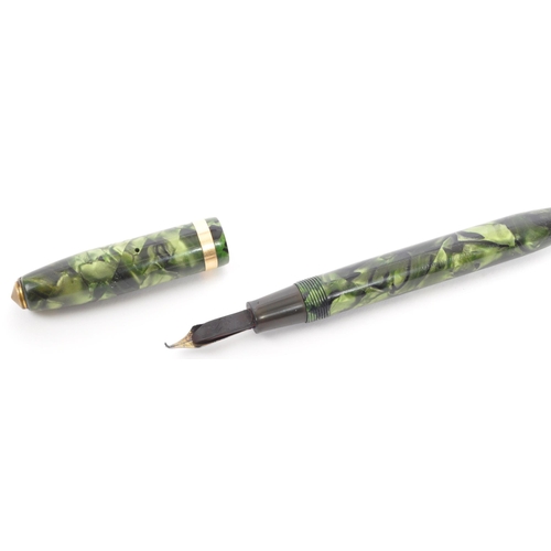 317 - A pair of vintage 20th century circa. 1940's lucite fountain pens. To include a green example with m... 