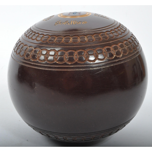 328 - A 20th Century Cotswold Goldline lawn bowls. Having four bowls, size four in a brown colourway with ... 