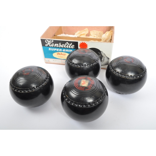 335 - A set of four Australian Henselite garden lawn bowls. Medium weight super grip championship model bo... 