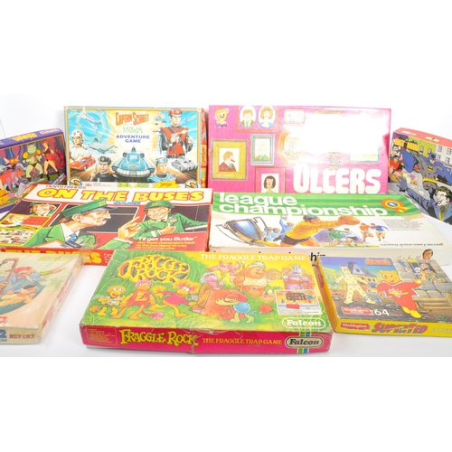 338 - A collection of vintage TV & Film related board games and puzzles to include; Peter Pan Playthings C... 