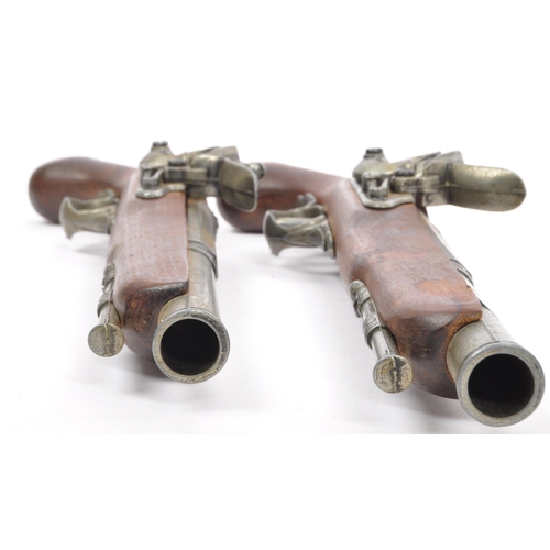 350 - A pair of replica reproduction flintlock wall mountable decorative 18th century pistols. Of wood and... 