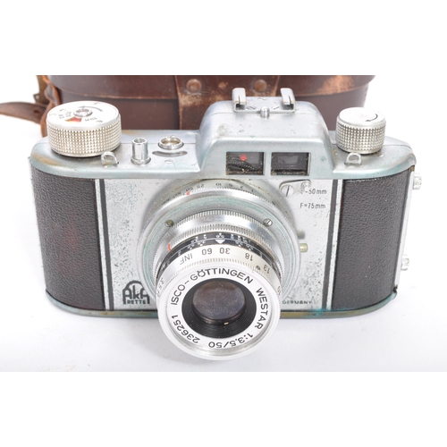 353 - A vintage cased 35mm cased Praktica BX20 camera with Praktica Pentacon lenses (x2) together with anÂ... 