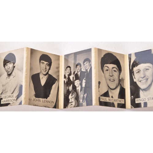 355 - A vintage 20th century The Beatles pin badge brooch. In the form of a book with concertina photos of... 