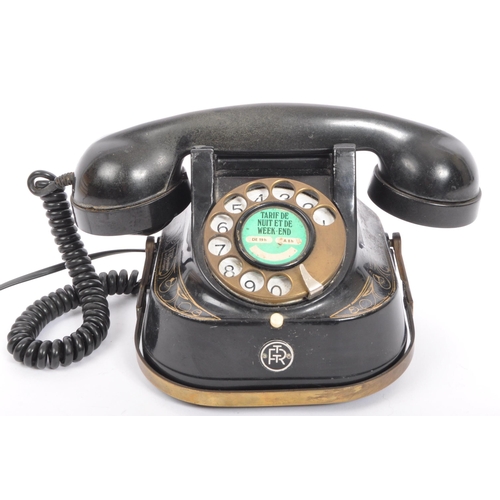 357 - An early 20th century metal gilded Belgium Telephone Company telephone marked 'Tarif De Nuit Et De W... 