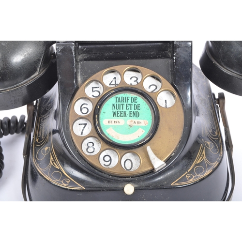 357 - An early 20th century metal gilded Belgium Telephone Company telephone marked 'Tarif De Nuit Et De W... 