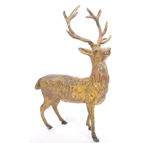 358 - A vintage 20th century statue figure of a stag. In a standing position with black hoofs and antlers.... 