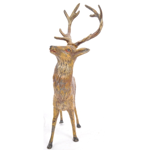 358 - A vintage 20th century statue figure of a stag. In a standing position with black hoofs and antlers.... 