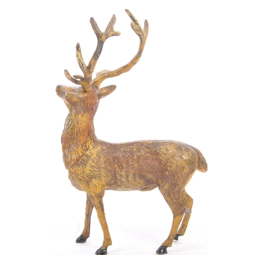 358 - A vintage 20th century statue figure of a stag. In a standing position with black hoofs and antlers.... 