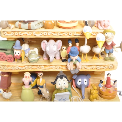 363 - Classics Walt Disney Collections - Two painted porcelain figurine / statues comprising of; Pinocchio... 