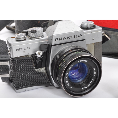 369 - A collection of retro vintage 20th century cameras & camera equipment. The lot to include a Praktica... 