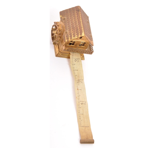 376 - A 19th century Victorian circa. 1870's Avery style gilt metal tape measure in the form of a watermil... 