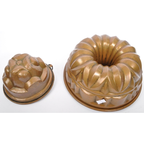 391 - A collection of 19th century copper jelly moulds to include a Christian Wagner alongside a variety o... 