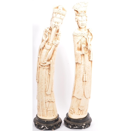 395 - A pair of 20th century Chinese figures in the form of Chinese elders depicted robed and crowned on s... 