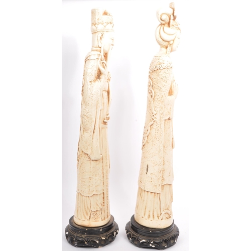 395 - A pair of 20th century Chinese figures in the form of Chinese elders depicted robed and crowned on s... 