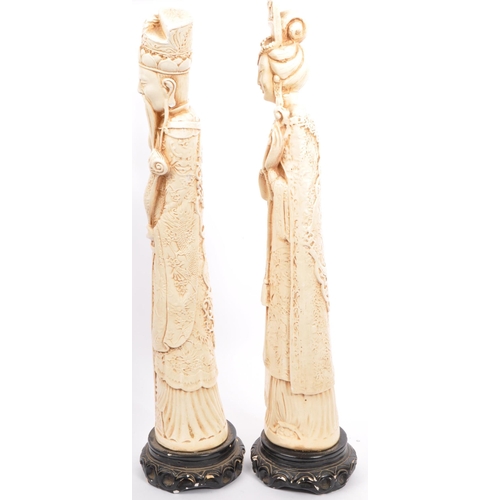 395 - A pair of 20th century Chinese figures in the form of Chinese elders depicted robed and crowned on s... 