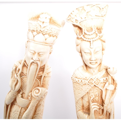 395 - A pair of 20th century Chinese figures in the form of Chinese elders depicted robed and crowned on s... 