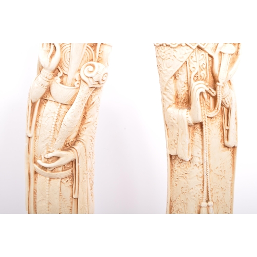 395 - A pair of 20th century Chinese figures in the form of Chinese elders depicted robed and crowned on s... 