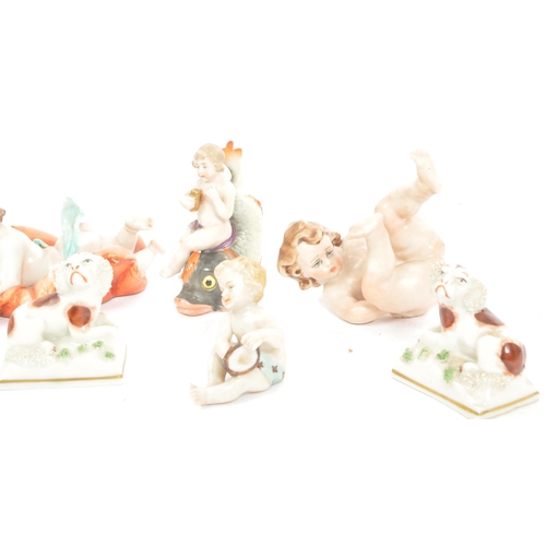 5 - A group of seven early 20th Century Capodimonte Naples ceramic figurines in the form of babies, infa... 