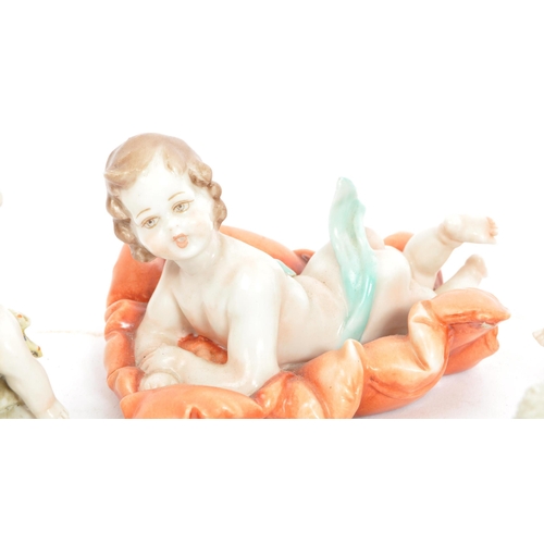 5 - A group of seven early 20th Century Capodimonte Naples ceramic figurines in the form of babies, infa... 