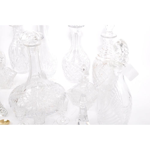 54 - A good collection of vintage early and later 20th century cut glass lead decanters to include decant... 