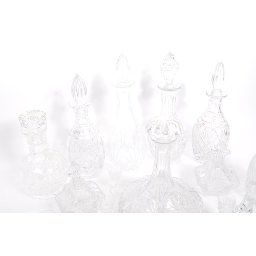 54 - A good collection of vintage early and later 20th century cut glass lead decanters to include decant... 