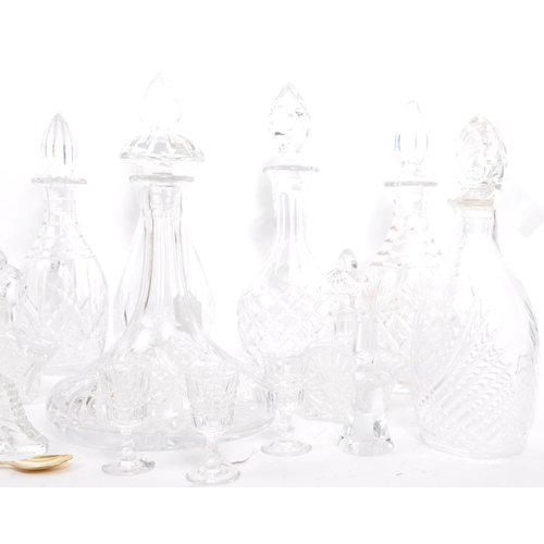 54 - A good collection of vintage early and later 20th century cut glass lead decanters to include decant... 