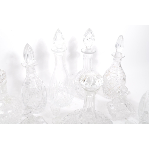 54 - A good collection of vintage early and later 20th century cut glass lead decanters to include decant... 