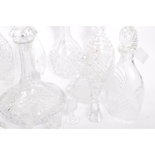 54 - A good collection of vintage early and later 20th century cut glass lead decanters to include decant... 