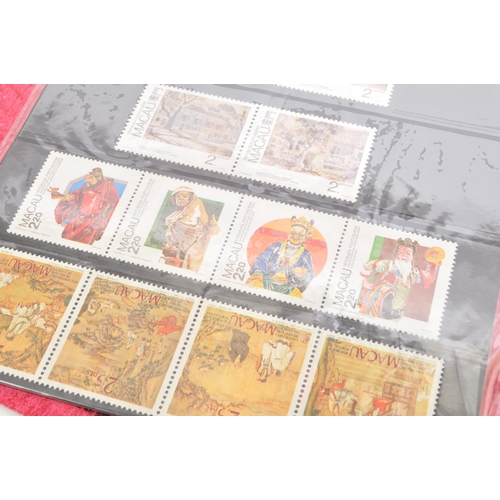 544 - A collection of Oriental / Hong Kong related coins and stamps comprising; x2 1997 Hong Kong handover... 