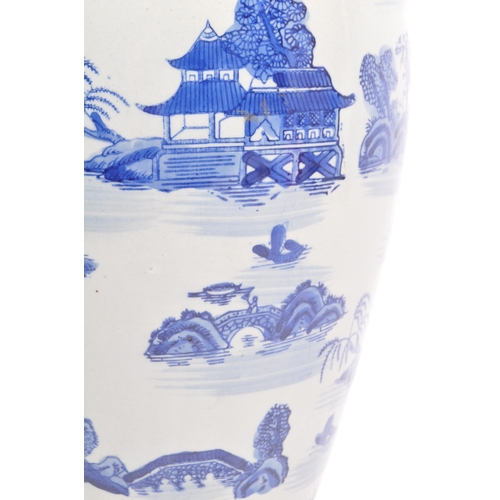 67 - A vintage 20th century Chinese Oriental ceramic blue & white planter vase having a baluster shape wi... 