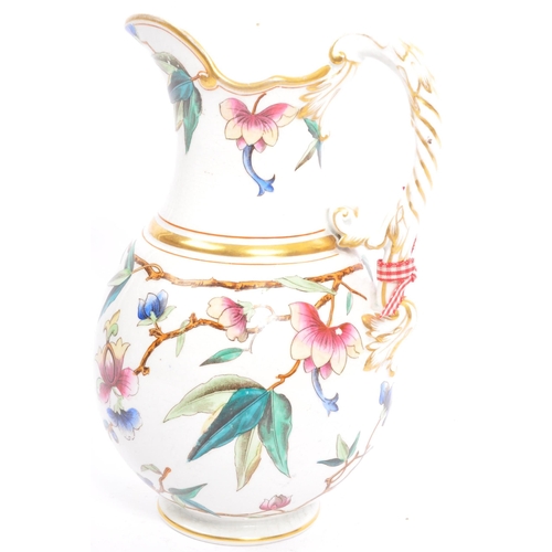 91 - A Victorian 19th century hand painted pitcher jug. The jug being hand painted with gilt details and ... 