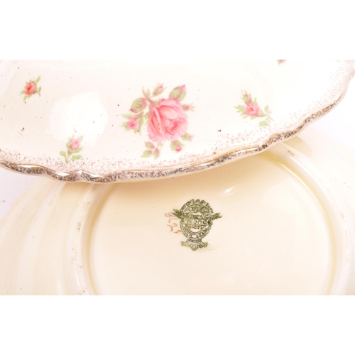 92 - Classic mid 20th century dinner ware, roses set / service by Clarice Cliff & Crown Ducal. Consisting... 